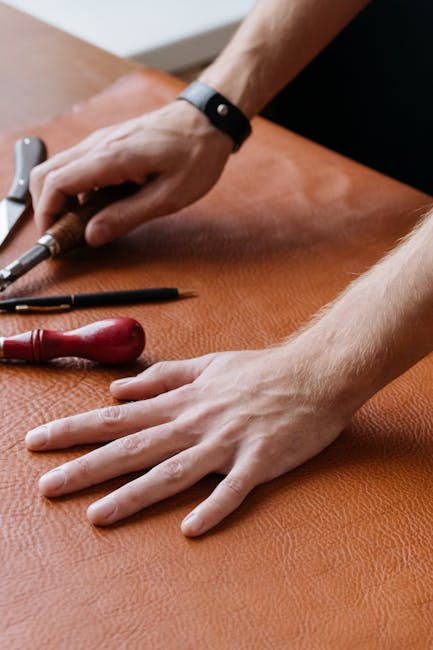 craftsman leather workshop hands tooling