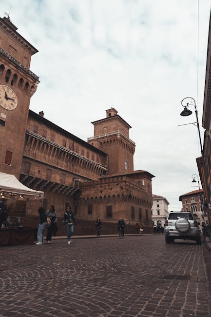 Ferrara medieval street arcades afternoon