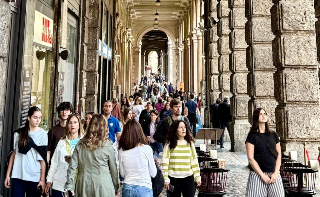 Family under Bologna porticoes shopping