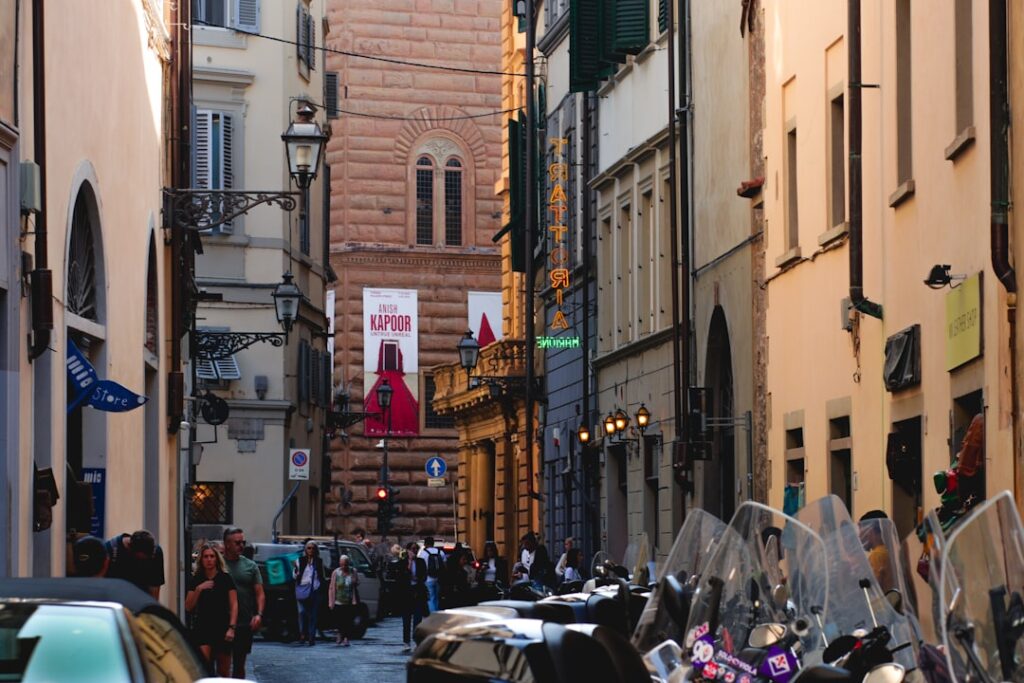 Florence narrow street midday crowd