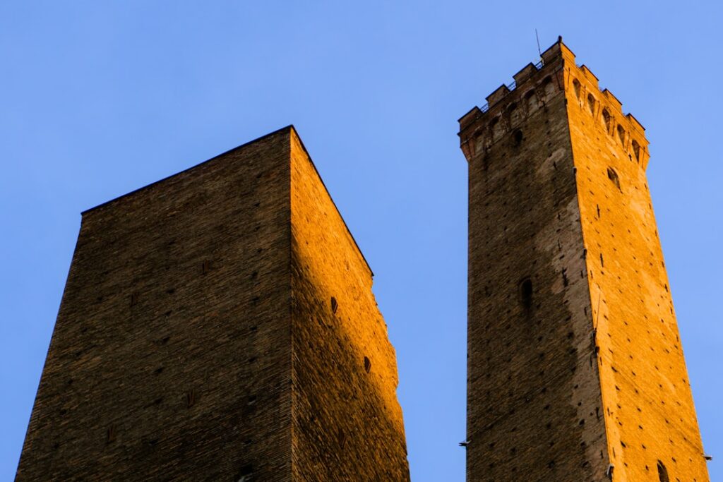 Medieval brick tower narrow street Bologna