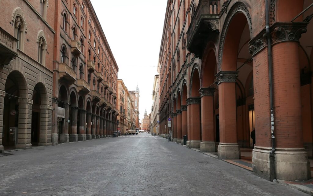 walking cobbled street santo stefano bologna morning
